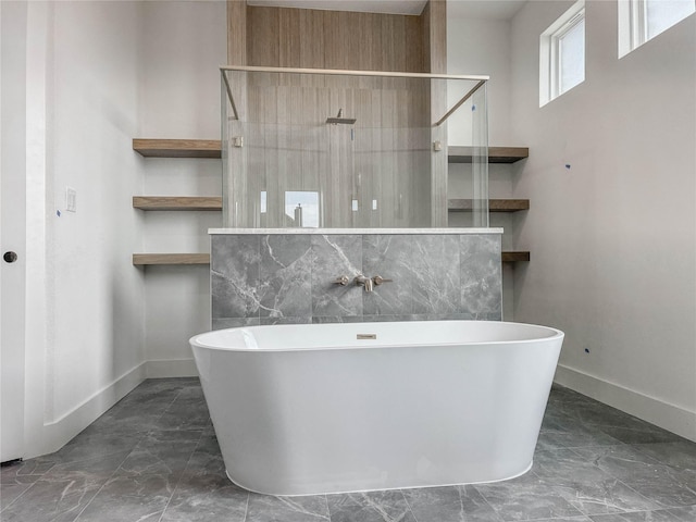 bathroom with decorative backsplash and independent shower and bath