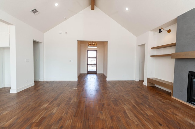 unfurnished living room with beamed ceiling, high vaulted ceiling, dark hardwood / wood-style floors, and a fireplace