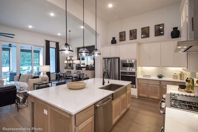 4121 Buffalo Clover Dr, Aubrey, TX 76227 - kitchen with stainless steel appliances, backsplash, dark wood finished floors, an island with sink, and open floor plan