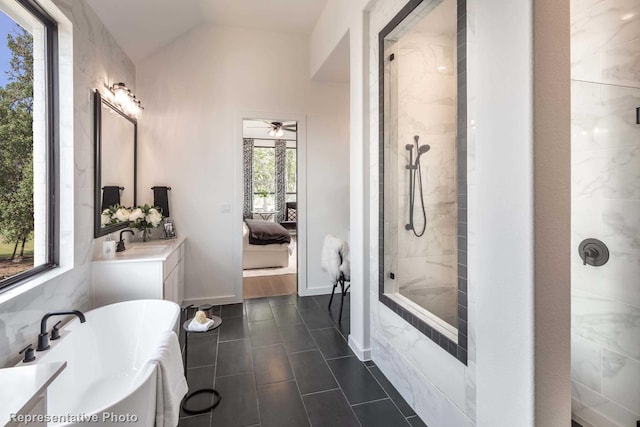 4121 Buffalo Clover Dr, Aubrey, TX 76227 - ensuite bathroom featuring vanity, a freestanding tub, tiled shower, tile patterned floors, and a ceiling fan