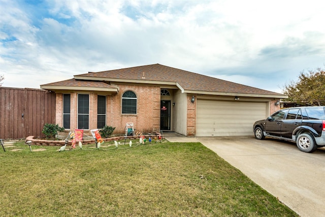 ranch-style house featuring a garage and a front lawn