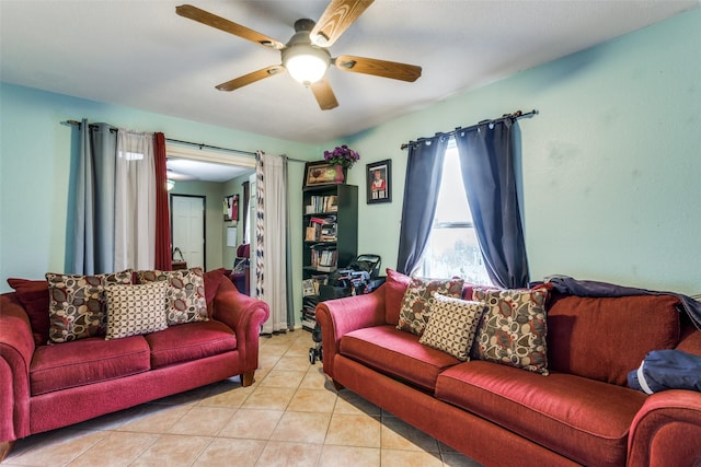 tiled living room with ceiling fan