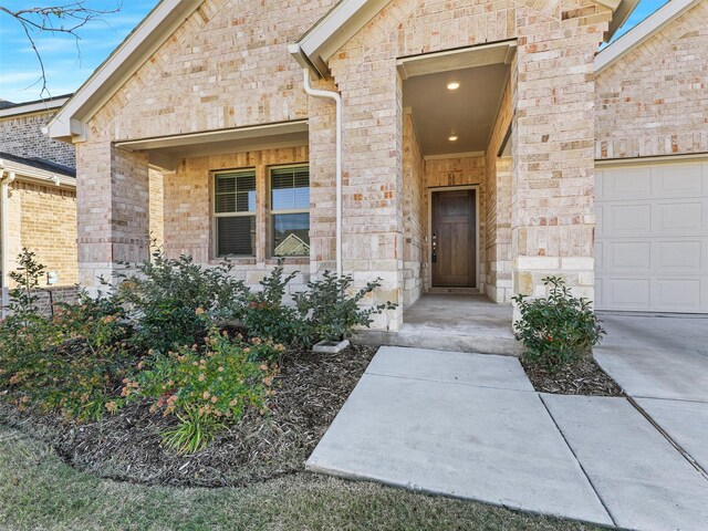 view of front of property with a garage and a front lawn