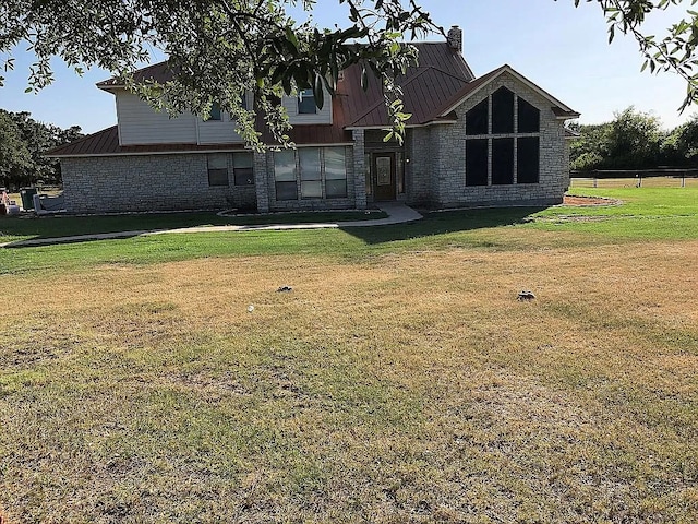 back of house featuring a yard