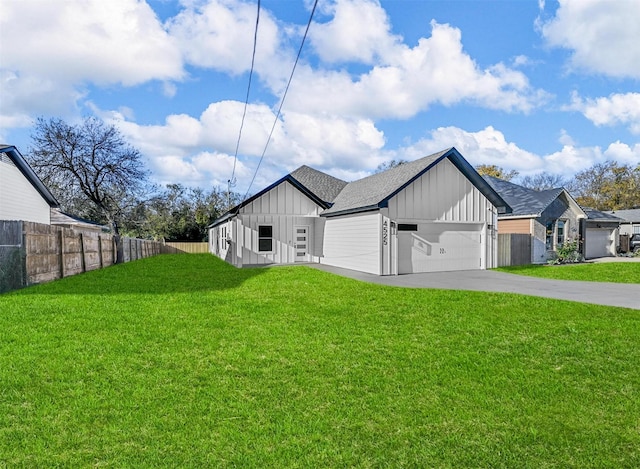 view of front facade with a front yard and a garage