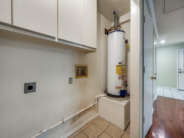 utility room with gas water heater