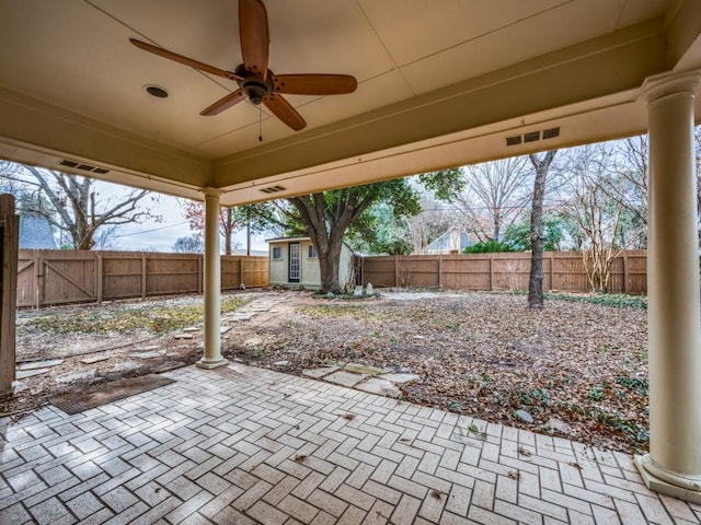 view of patio featuring an outdoor structure and ceiling fan