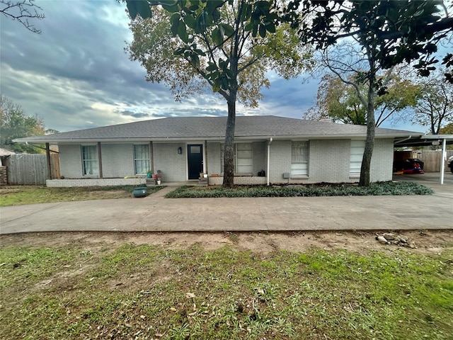 single story home with a carport