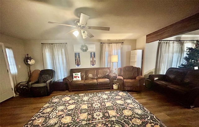 living room featuring hardwood / wood-style flooring, ceiling fan, and a textured ceiling