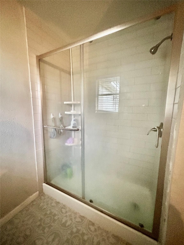 bathroom featuring an enclosed shower