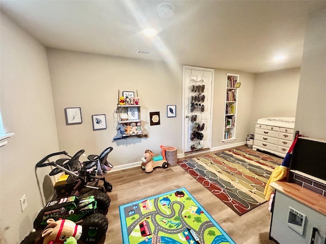 709 Kerry Ln, Azle, TX 76020 - playroom with wood finished floors and built in shelves