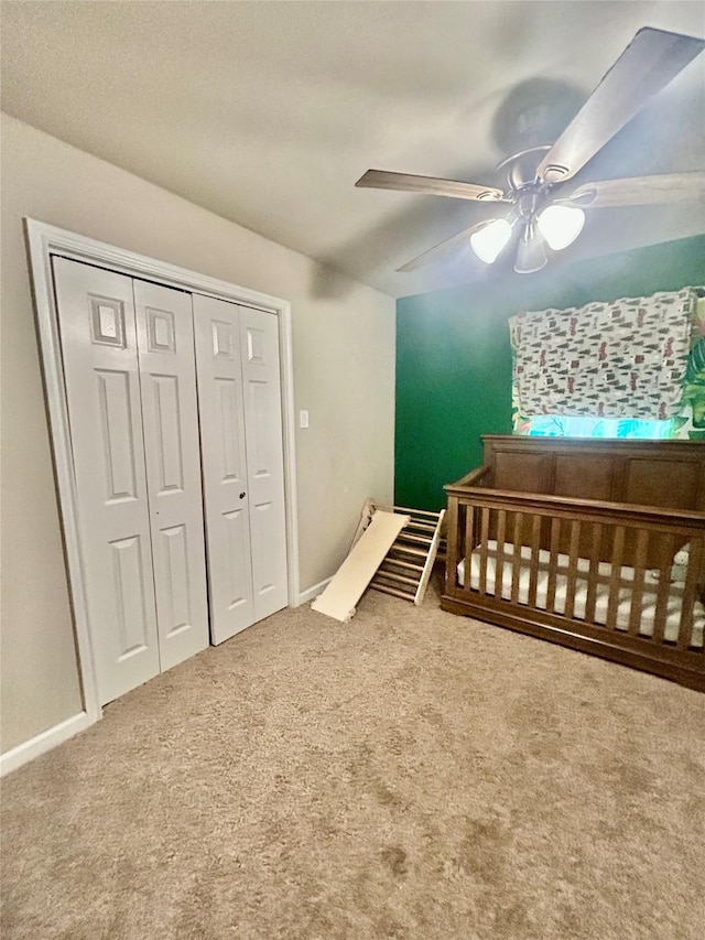 709 Kerry Ln, Azle, TX 76020 - bedroom with carpet floors, a ceiling fan, a closet, and a nursery area