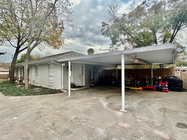 709 Kerry Ln, Azle, TX 76020 - view of vehicle parking with concrete driveway and a carport