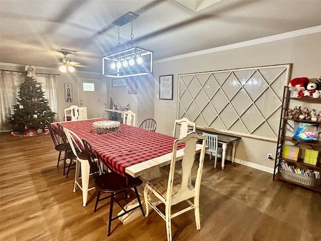 dining space with ceiling fan, dark hardwood / wood-style floors, and ornamental molding