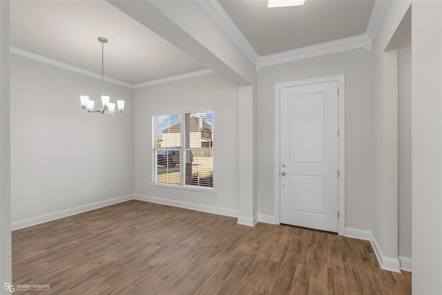 interior space featuring hardwood / wood-style flooring, a notable chandelier, and ornamental molding