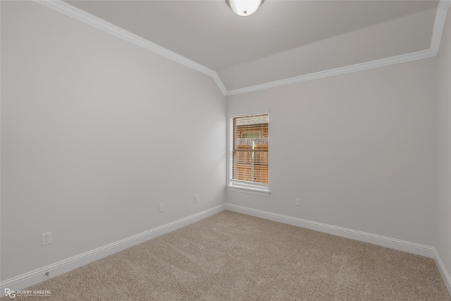 unfurnished room with carpet flooring, crown molding, and vaulted ceiling