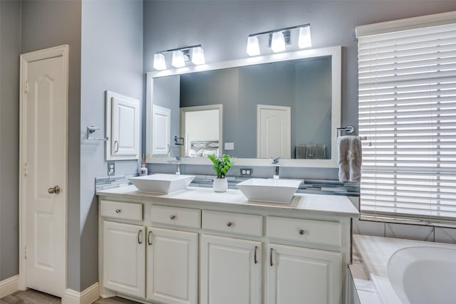 bathroom featuring vanity and a bathtub