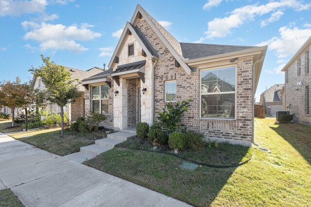 2013 Barx Dr, Little Elm, TX 75068 - view of front of property with brick siding, a shingled roof, and stone siding