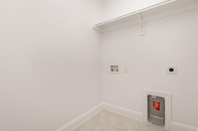 washroom with hookup for a washing machine, light tile patterned floors, and hookup for an electric dryer