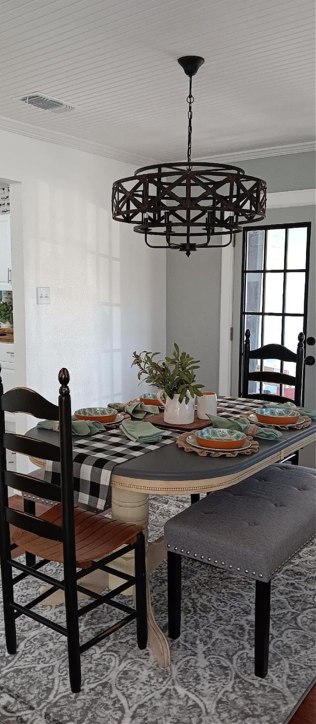 dining area featuring crown molding