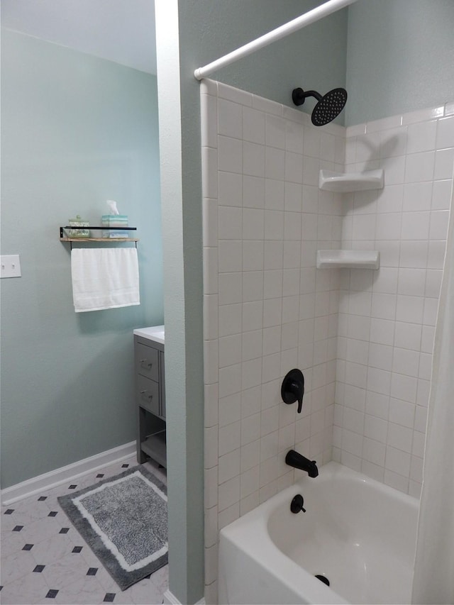 bathroom featuring vanity and tiled shower / bath combo