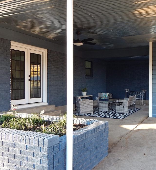 view of patio / terrace featuring ceiling fan and french doors