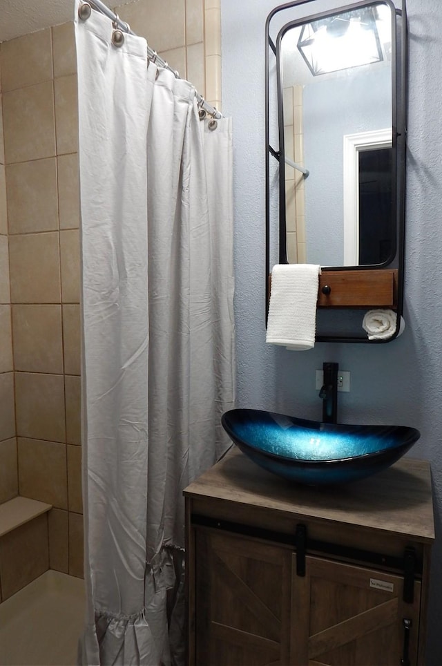 bathroom with vanity and walk in shower