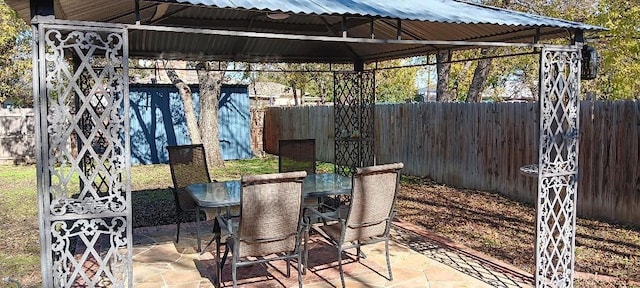 view of patio / terrace with a gazebo and an outdoor bar