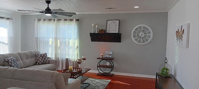 living room featuring crown molding, dark hardwood / wood-style flooring, and ceiling fan