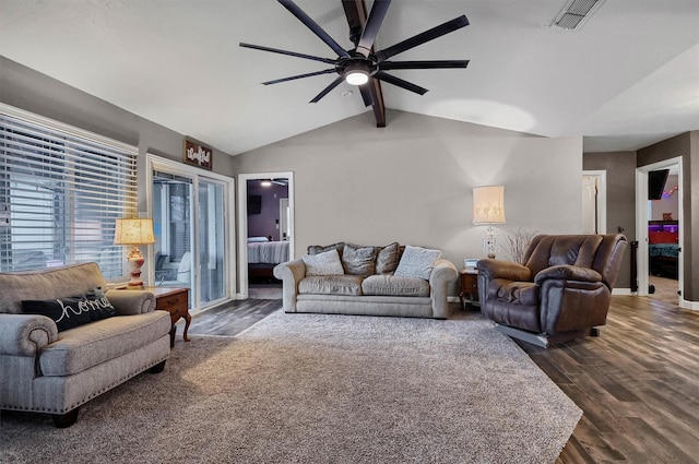 living room with vaulted ceiling with beams, ceiling fan, and dark wood-type flooring