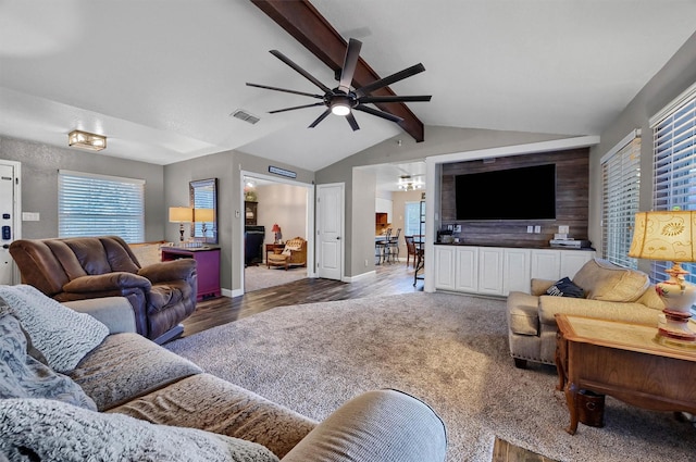 living room featuring ceiling fan, lofted ceiling with beams, and wood-type flooring