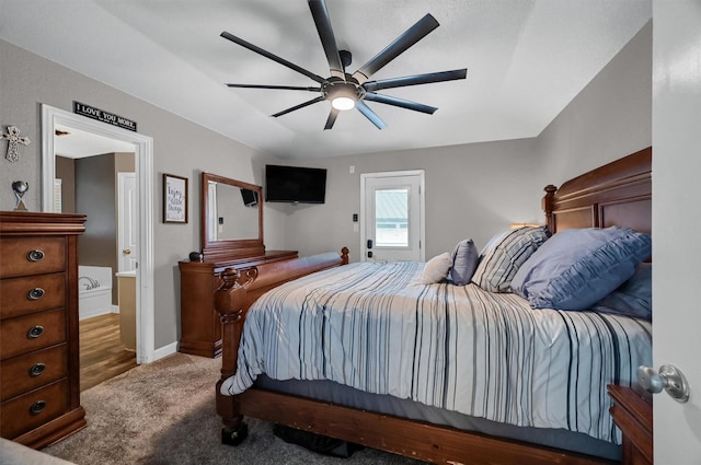 carpeted bedroom with ceiling fan and lofted ceiling