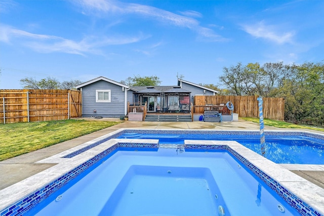 view of swimming pool featuring a gazebo, an in ground hot tub, and a yard