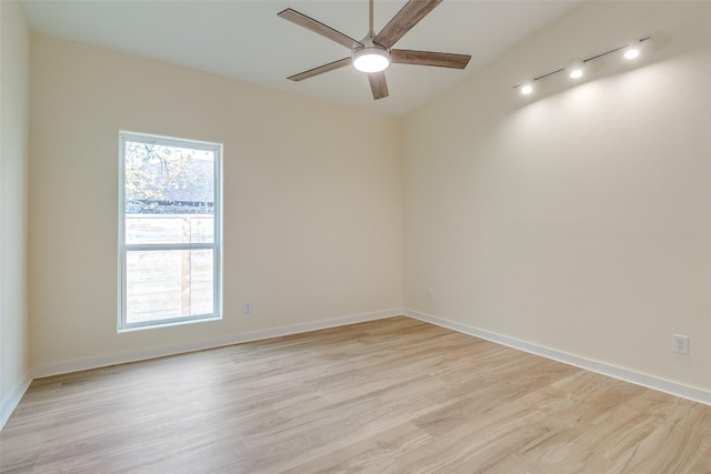 empty room featuring ceiling fan and light hardwood / wood-style flooring