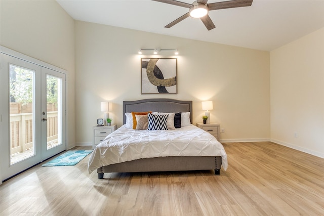 bedroom featuring french doors, access to outside, ceiling fan, light hardwood / wood-style flooring, and lofted ceiling