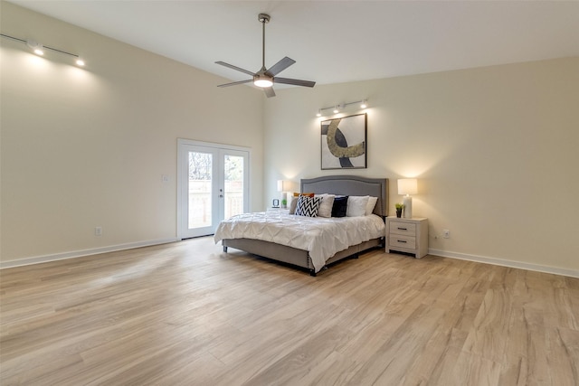 bedroom with access to exterior, french doors, light hardwood / wood-style flooring, and ceiling fan