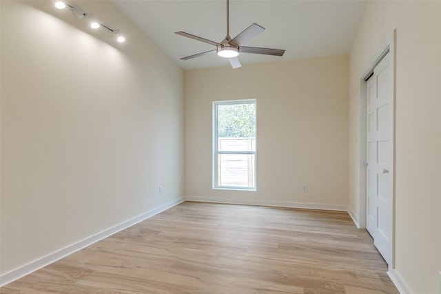 unfurnished room with ceiling fan and light hardwood / wood-style flooring