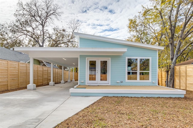 rear view of property with french doors