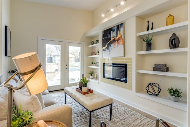 living room featuring built in features and french doors