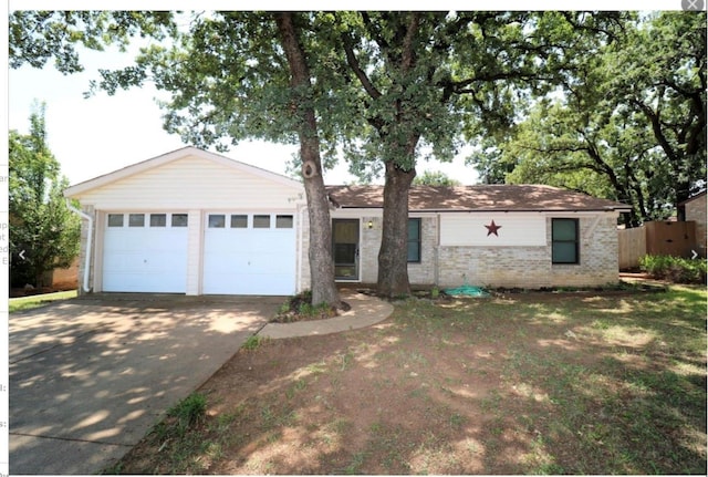 ranch-style house featuring a garage