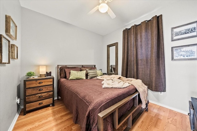 bedroom featuring light hardwood / wood-style flooring and ceiling fan