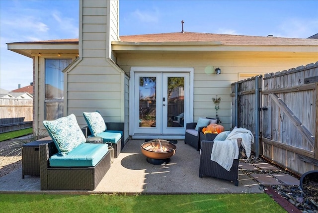 view of patio featuring french doors and an outdoor fire pit