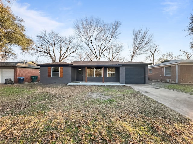 ranch-style house with a garage and a front yard