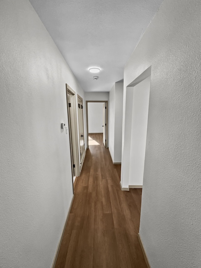 hall featuring dark hardwood / wood-style floors