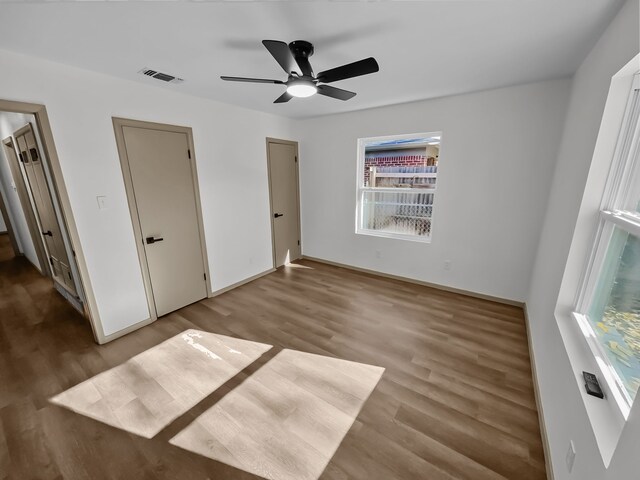 empty room featuring ceiling fan and wood-type flooring