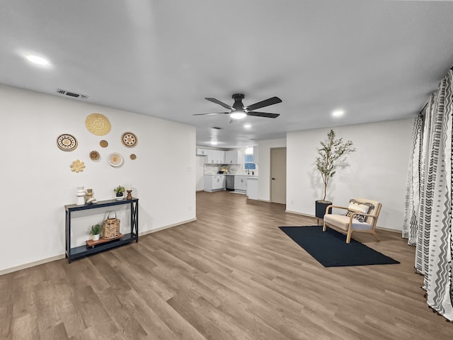 sitting room featuring hardwood / wood-style flooring and ceiling fan