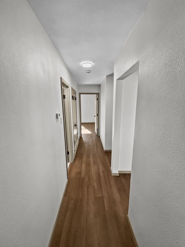 laundry area featuring hookup for an electric dryer, hookup for a washing machine, and hardwood / wood-style flooring