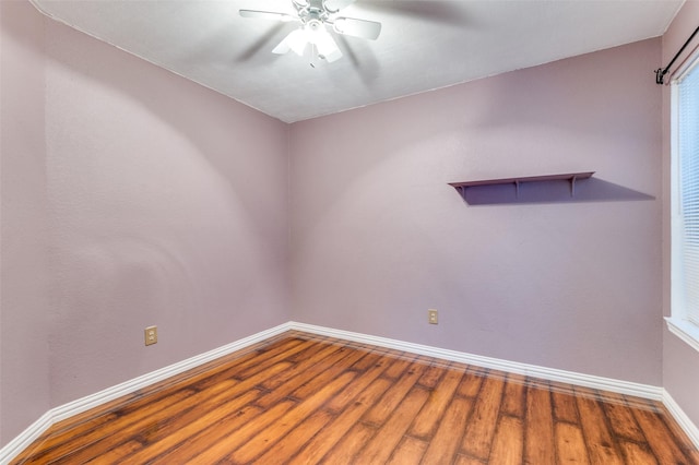 spare room featuring ceiling fan and hardwood / wood-style flooring