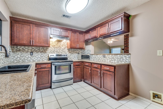 kitchen with sink, tasteful backsplash, ceiling fan, and electric stove