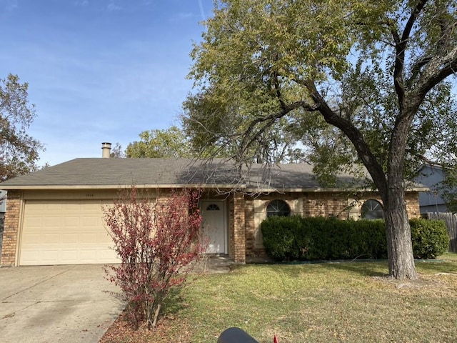 ranch-style house with a garage and a front lawn